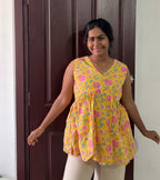 Yellow floral sleeveless Peplum Top